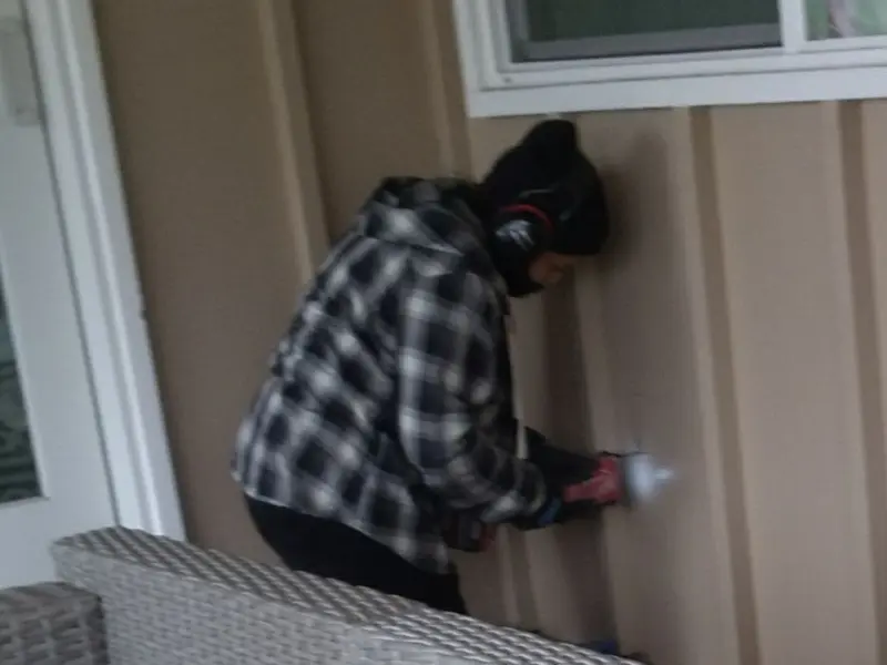 Professional electrician installing an exterior outlet in Middleburgh