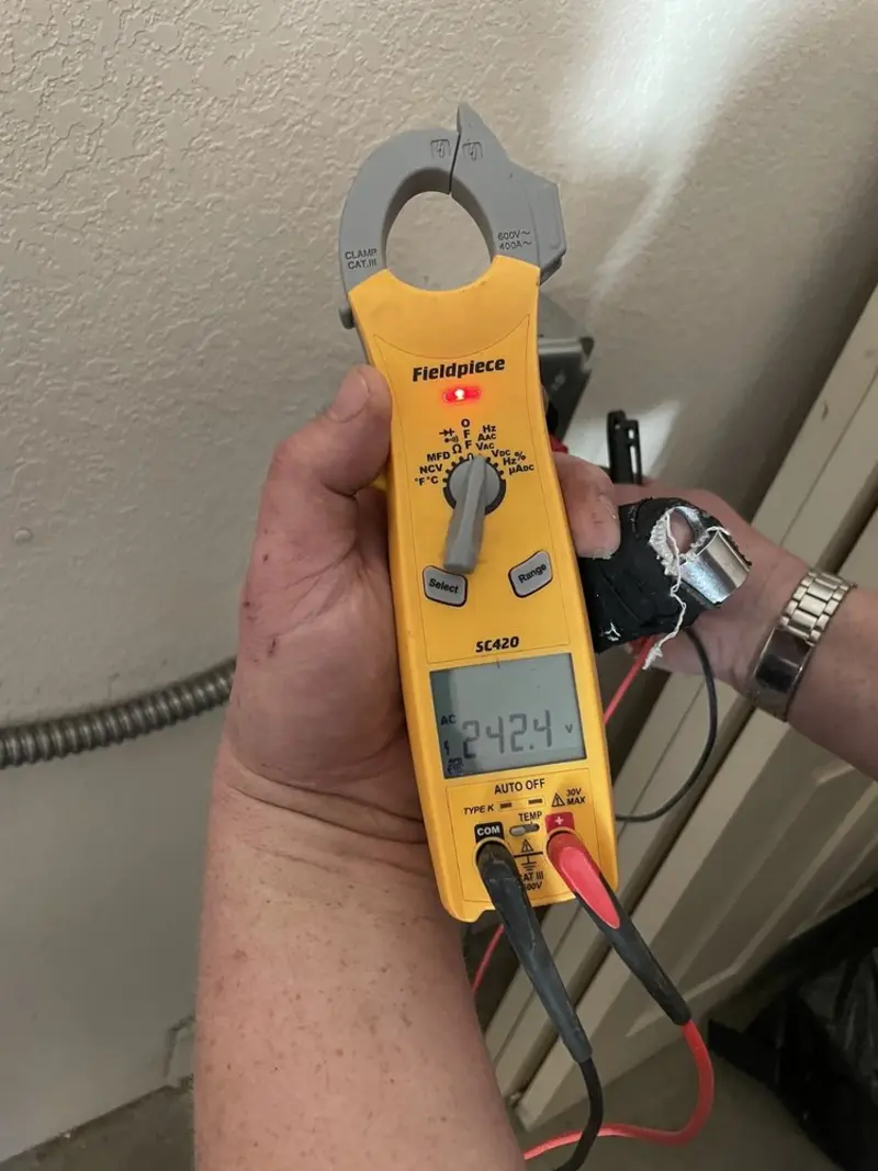 Voltage testing with clamp meter during Electrical Installation Services in Middleburgh